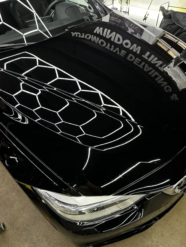 Deep gloss reflections on a black car bonnet protected with EAGLE PPF
